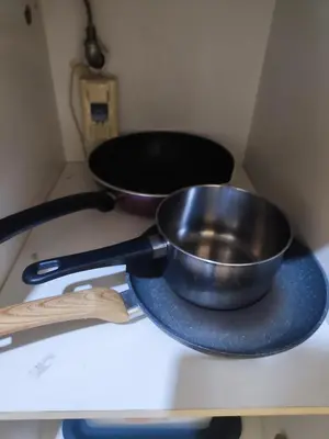 a frying pan on a blue plate on a counter at Bintang Fairlane 2mins PavilionKL TRX KLCC - AJhome in Kuala Lumpur
