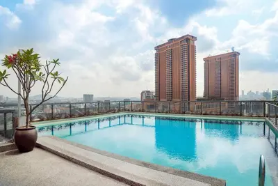 a swimming pool on top of a building with tall buildings at Bintang Fairlane 2mins PavilionKL TRX KLCC - AJhome in Kuala Lumpur