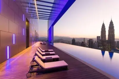 a room with a pool with a view of a city at Maxhome Plus @ The Platinum KLCC in Kuala Lumpur