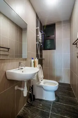 a bathroom with a sink and a toilet at Legasi Kampung Baru - Idealhub in Kuala Lumpur
