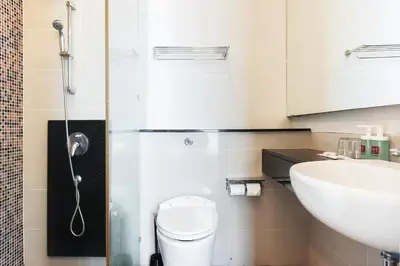 a bathroom with a toilet and a sink at SG Residence Bukit Bintang in Kuala Lumpur