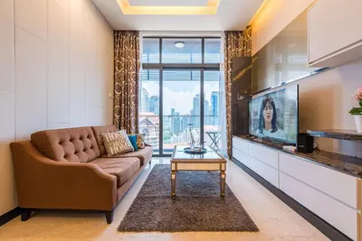 a living room with a couch and a tv at Dorsett Residence Kuala Lumpur 17 in Kuala Lumpur