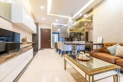 a living room with a couch and a table at Dorsett Residence Kuala Lumpur 12 in Kuala Lumpur