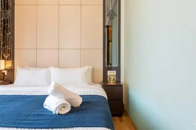 a hotel room with a bed with towels on it at Dorsett residence Kuala Lumpur 19 in Kuala Lumpur