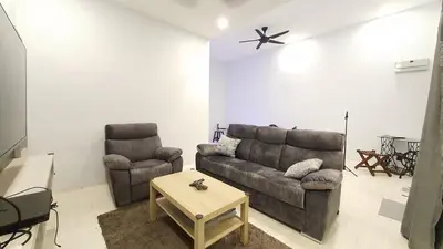a living room with a couch and two chairs at A Place Like Home Landed House Kuala Lumpur in Kuala Lumpur