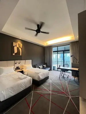 a hotel room with two beds and a ceiling fan at M101 Dang Wangi remote work-friendly suite in Kuala Lumpur