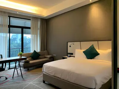 a bedroom with a bed and a desk and a couch at M101 Dang Wangi remote work-friendly suite in Kuala Lumpur