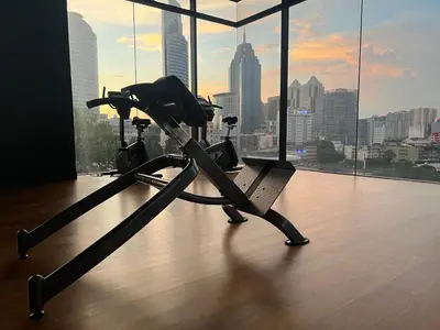 an exercise bike in a room with a view of a city at Anggun KL Malaysia in Kuala Lumpur
