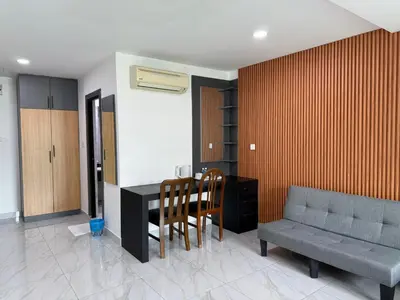 a living room with a table and chairs and a couch at Prime Suite at Ampang - Individual Private Rooms in Kuala Lumpur
