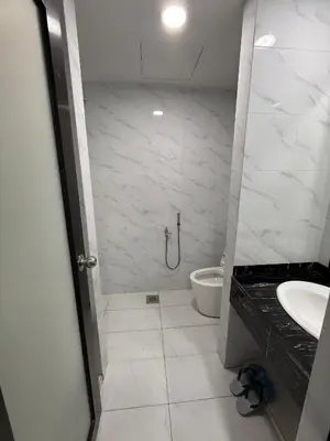 a bathroom with a shower and a sink and a toilet at Prime Suite at Ampang - Individual Private Rooms in Kuala Lumpur