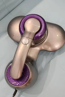 a purple and silver spoon sitting on a table at The Nova by The City Collection in Kuala Lumpur