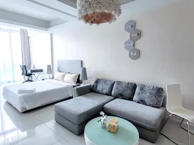 a living room with a couch and a bed at Damas Residence Kuala Lumpur in Kuala Lumpur