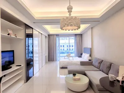 a living room with a couch and a bed at Damas Residence Kuala Lumpur in Kuala Lumpur