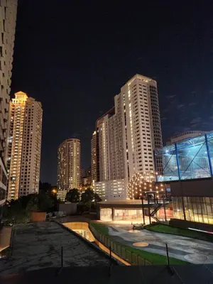 a city skyline at night with tall buildings at Mont Kiara The Ooak Suites & Residences l 1BR in Kuala Lumpur