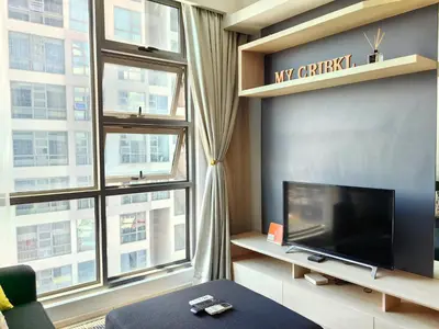 a living room with a tv and a large window at MyCrib13*The Robertson KL - Bukit Bintang Pavilion in Kuala Lumpur