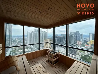 a balcony with a view of a city at NOVO Serviced Suites by Widebed, Jalan Ampang, Gleneagles in Kuala Lumpur