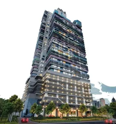 a tall building with lights on the side of it at NOVO Serviced Suites by Widebed, Jalan Ampang, Gleneagles in Kuala Lumpur