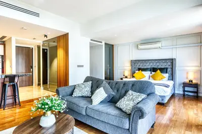 a living room with a couch and a bed at MyRehat Anggun Residences in Kuala Lumpur