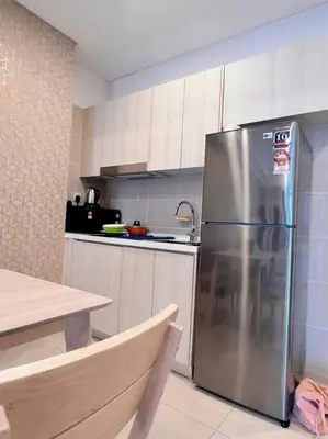 a kitchen with a stainless steel refrigerator in it at Seputeh Cozy & Homely VIVO Suite Old Klang Road Near MidValley, The Garden Mall in Kuala Lumpur