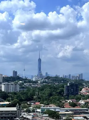a city with a tall building in the distance at Seputeh Cozy & Homely VIVO Suite Old Klang Road Near MidValley, The Garden Mall in Kuala Lumpur