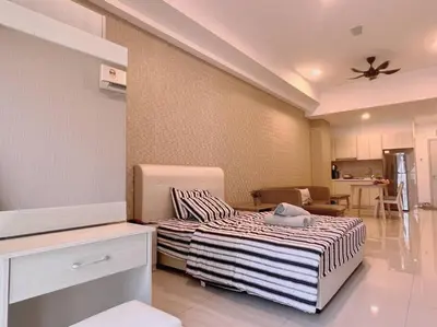 a bedroom with a bed and a living room at Seputeh Cozy & Homely VIVO Suite Old Klang Road Near MidValley, The Garden Mall in Kuala Lumpur