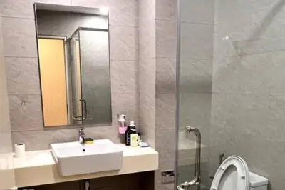 a bathroom with a sink and a mirror and a shower at Seputeh Cozy & Homely VIVO Suite Old Klang Road Near MidValley, The Garden Mall in Kuala Lumpur