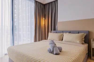 a stuffed animal on a bed in a bedroom at Datum Jelatek Balcony w Infinity Pool Linked LRT KLCCView Mall in Kuala Lumpur