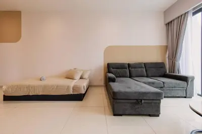 a living room with a couch and a bed at Datum Jelatek Balcony w Infinity Pool Linked LRT KLCCView Mall in Kuala Lumpur