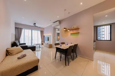 a living room and dining room with a table and a couch at Datum Jelatek Balcony w Infinity Pool Linked LRT KLCCView Mall in Kuala Lumpur