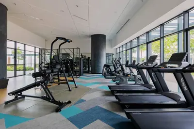 a gym with treadmills and elliptical machines at Datum Jelatek Balcony w Infinity Pool Linked LRT KLCCView Mall in Kuala Lumpur