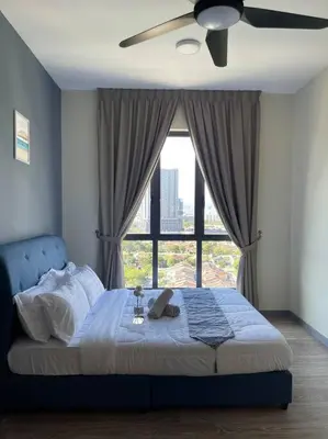 a bedroom with a bed with a large window at Cozy Family Suite Kepong DesaPark MontKiara Publika Mitec in Kuala Lumpur