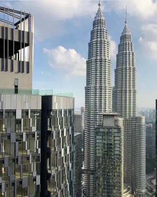 a view of the petronas twin towers from a skyscraper at Star Residence Apartment with High Kuala Lumpur view in Kuala Lumpur