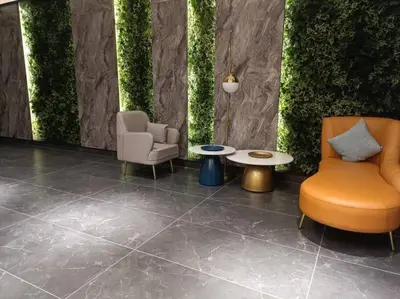 a lobby with two chairs and a table and plants at Muji Style, Inspirasi Residences Mont Kiara in Kuala Lumpur