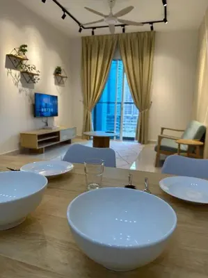 a wooden table with white bowls on top of it at Inspirasi Residences Mont Kiara muji house in Kuala Lumpur