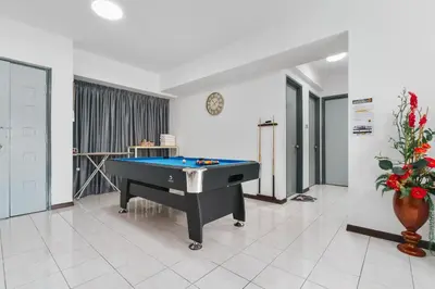 a room with a pool table in a room with at Plaza Berjaya Apt Bukit Bintang with Pool Table in Kuala Lumpur