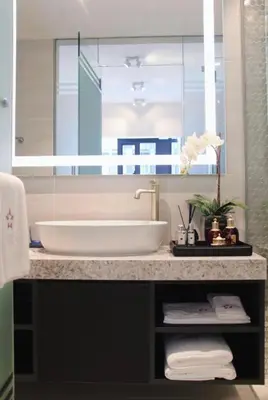 a bathroom with a sink and a large mirror at Star Residence Apartment with twin towers KLCC view in Kuala Lumpur