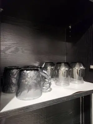 a row of glass mason jars sitting on a shelf at KL Serenity Quarter Flexus at Jln Kuching - Self C-In, F-Parking in Kuala Lumpur