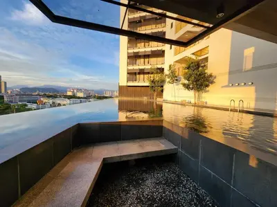 a view of a building with a pool of water at KL Serenity Quarter Flexus at Jln Kuching - Self C-In, F-Parking in Kuala Lumpur
