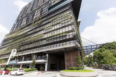 a tall building with a stairway in front of it at KL Serenity Quarter Flexus at Jln Kuching - Self C-In, F-Parking in Kuala Lumpur