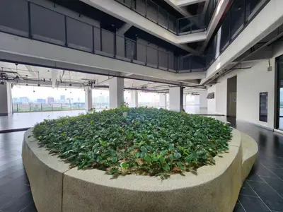 a large planter filled with green plants in a building at KL Serenity Quarter Flexus at Jln Kuching - Self C-In, F-Parking in Kuala Lumpur