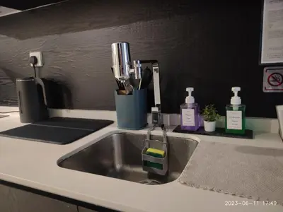 a kitchen sink with a faucet and tooth brushes at KL Serenity Quarter Flexus at Jln Kuching - Self C-In, F-Parking in Kuala Lumpur