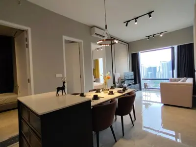 a kitchen and living room with a table and chairs at The Axon Bukit Bintang by SMOVF BNB in Kuala Lumpur