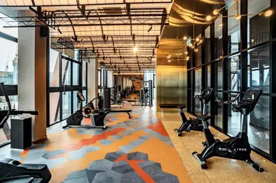 a gym with treadmills and elliptical machines at Scarletz Leisure Suites KLCC in Kuala Lumpur