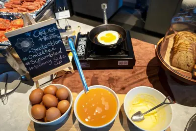 a table with eggs and bowls of food on a counter at Ceylonz Leisure Suites KLCC Bukit Bintang in Kuala Lumpur