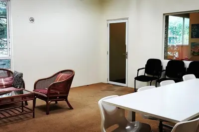 a room with chairs and a table and a table and chairs at KLCC Luxurious 2 Floors Homestay 5BR for 15pax in Kuala Lumpur