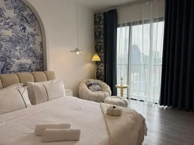 a bedroom with a large bed and a large window at Chambers Suite Studio KLCC PWTC by Unimax in Kuala Lumpur