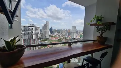 a balcony with a view of a city at Bricks & Beds Suite @ Legasi Kg Bahru in Kuala Lumpur