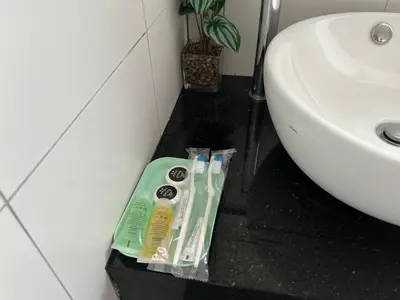 a bathroom with two toothbrushes and a sink at Chambers service suites klcc in Kuala Lumpur