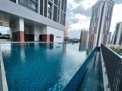 a large swimming pool in the middle of a city at Chambers service suites klcc in Kuala Lumpur
