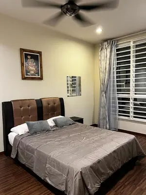 a bedroom with a bed with a ceiling fan at Zetapark, The Loft in Kuala Lumpur